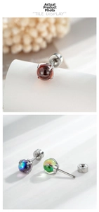 Detail view of colorful ball gemstone ear studs with flat back screw design in steel