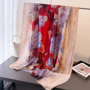 Floral print silk scarf with large purple flowers and red border on vintage display