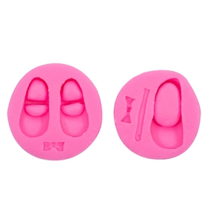 Pink silicone baby shoe molds for fondant and chocolate baking with cute bow designs