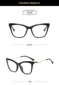 Detail of black cat-eye glasses frame featuring unique zigzag gold metal temples