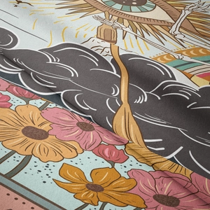 Detail of fabric texture showing intricate gold eye and pink floral tarot tapestry patterns