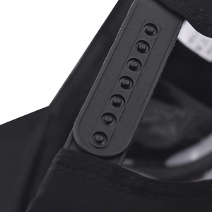 Close-up of adjustable snapback buckle and neat stitching on black baseball cap