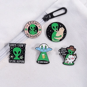 Cute alien and space cat enamel pin set with 5 creative cartoon metal badges on fabric