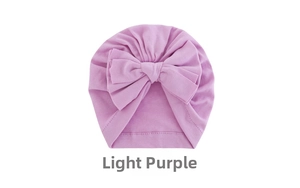 Detailed close-up of light purple baby turban hat featuring a large decorative soft bow