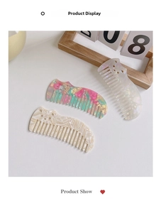 Detailed view of acetate hair combs with marble texture and cute cat ear designs