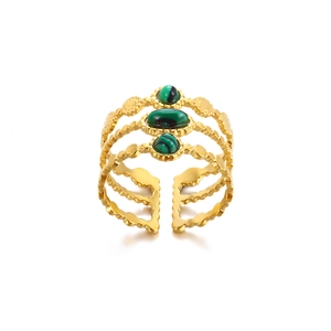 Detailed close-up of multi-layer gold wavy ring with green malachite stone insets
