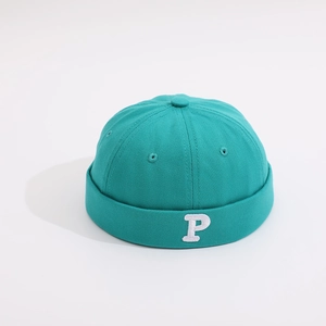Detailed view of mint green cotton canvas docker hat with white embroidered P letter