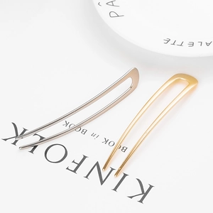 Minimalist U-shaped metal hairpins in gold and silver finish for stylish buns
