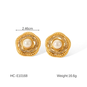 Detailed close-up of 2.46cm gold floral stud earrings with white pearls and spiral edges