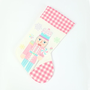 Pink and white checkered Nutcracker Christmas stocking gift bag for holiday tree decoration