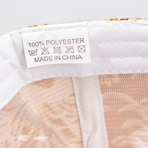 Detail shot of the internal care label showing 100% polyester material and washing symbols