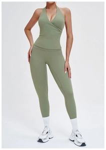 Detail of sage green brushed yoga set featuring a halter V-neck top and high waist leggings