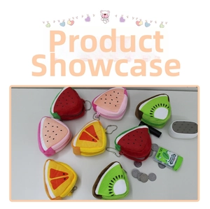 Detail of plush fruit coin purses featuring zipper closure and silver bead chain hangers