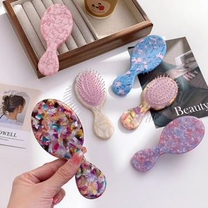 French vintage acetate hair combs set with colorful floral patterns and massage bristles