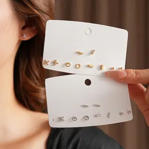 Elegant geometric gold and silver stud earrings set featuring sparkling cubic zirconia