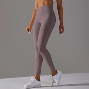 Detail view of high waist yoga pants in mauve grey with seamless lifting effect