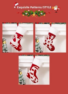 Detail of embroidered reindeer and snowflake Christmas stockings with white faux fur trim