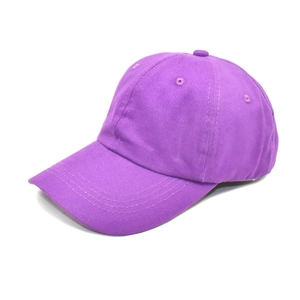 Detail view of purple cotton twill baseball cap with breathable eyelets and curved visor