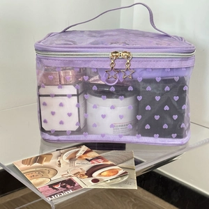Portable purple heart pattern mesh cosmetic bag with gold star zipper and ribbon handle