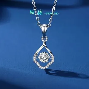 Macro detail of S925 sterling silver necklace with dancing diamond in teardrop pendant
