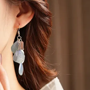 Elegant silver tassel earrings with blue frosted petal sequins and teardrop beads