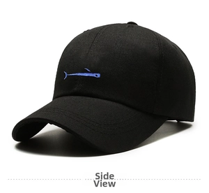 Detail shot of the blue hammerhead shark embroidery on a black cotton baseball cap