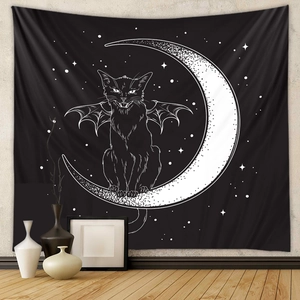 Detail view of Bohemian wall tapestry with black cat and crescent moon in home interior