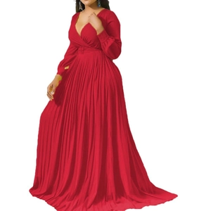 Detail of red deep V-neck pleated maxi dress with waist buckle and long sleeves