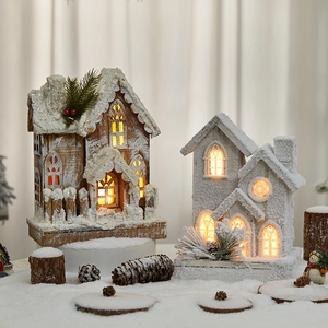 Set of 2 glowing wooden Christmas snow houses with warm LED lights and berry accents