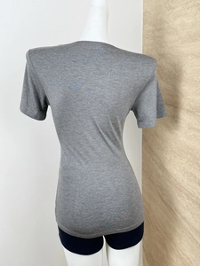 Back view of a grey short-sleeve V-neck knit T-shirt with a slim fit on a mannequin