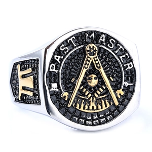 Macro view of vintage Freemason Past Master ring with gold details on silver stainless steel