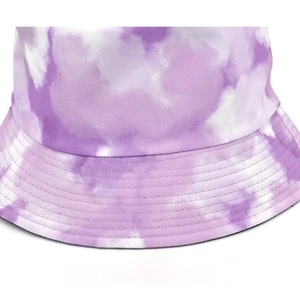 Detail of purple tie-dye bucket hat showing reinforced stitching and canvas texture