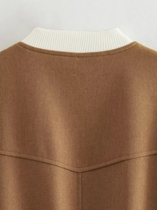 Detail of the high-density ribbed collar and twill fabric texture on the Y2K bomber jacket