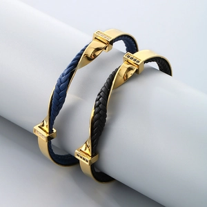 Detail view of woven leather bracelets with gold-plated stainless steel and crystal inlays