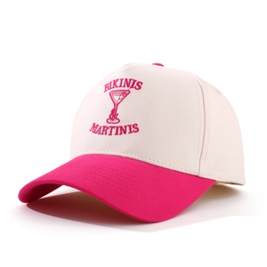 Macro detail of high-quality pink embroidery and cotton twill texture on a baseball cap