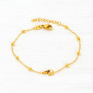Elegant gold titanium steel bead bracelet with a sparkling zircon pendant for women