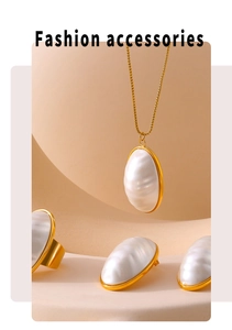 Macro view of gold-plated oval mother-of-pearl necklace, ring and earring jewelry set
