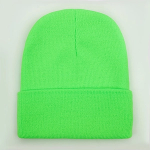 Neon green knitted beanie hat with classic cuffed design for winter warmth and style