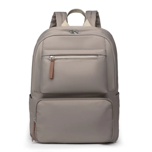 Minimalist grey nylon travel backpack with multiple zippered pockets and luggage strap