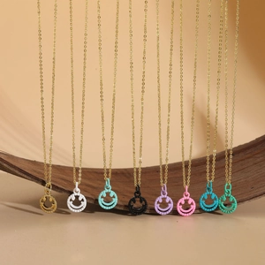 Close-up of minimalist colorful smiley face pendants on golden chains in eight vibrant colors