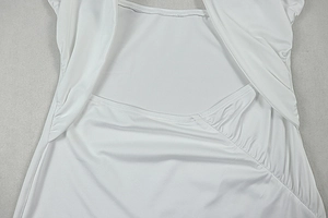 Detailed view of white elastic fabric with professional pleated design and sewing detail