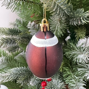 Set of 6 dark red football-shaped Christmas tree ornaments with white line detail