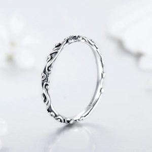 Vintage 925 sterling silver ring with engraved vine patterns shown from a 45-degree angle
