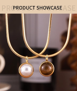 Detail showing gold snake chains with pearl and tiger eye stone pendants on high-quality finish