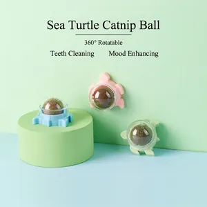 Rotating turtle-shaped catnip balls in pink, blue, and green for cat dental cleaning