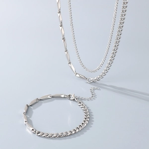 Detail of silver stainless steel Cuban and rhombus chain necklace and bracelet set