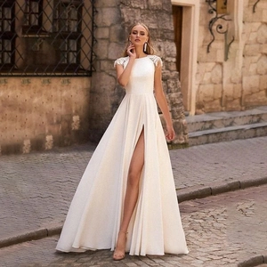 Elegant white satin mermaid bridal dress with lace sleeves and high slit details