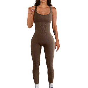 Detail of brown ribbed knit jumpsuit showing slim fit fabric and square neckline