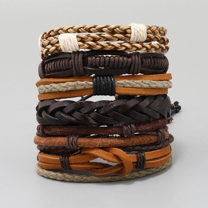 Detailed macro view of retro woven leather bracelet set with brown and black cords