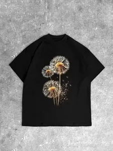 Oversize black cotton T-shirt featuring a detailed dandelion print on a stone background
